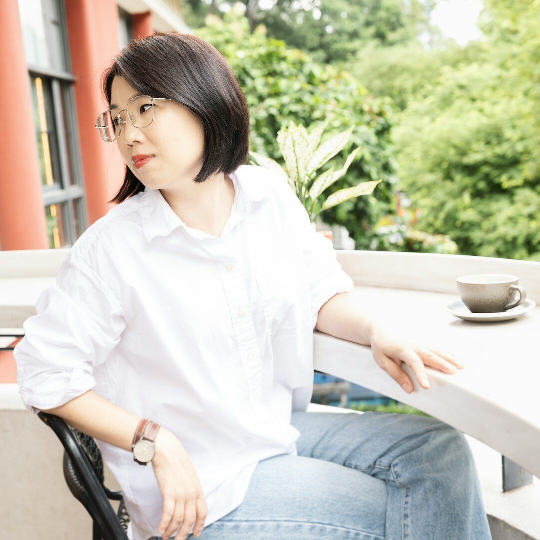 Smiling professional Asian woman satisfied after completing a public speaking course